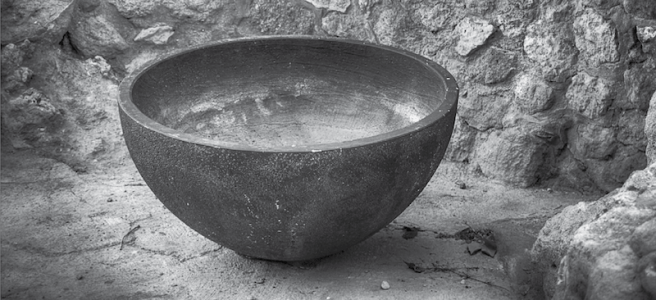 a black and white photograph of a hollowed out bowl